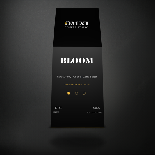 Bloom light roast specialty coffee packaging showing roast level by Omni Coffee Studio, front view on dark background.