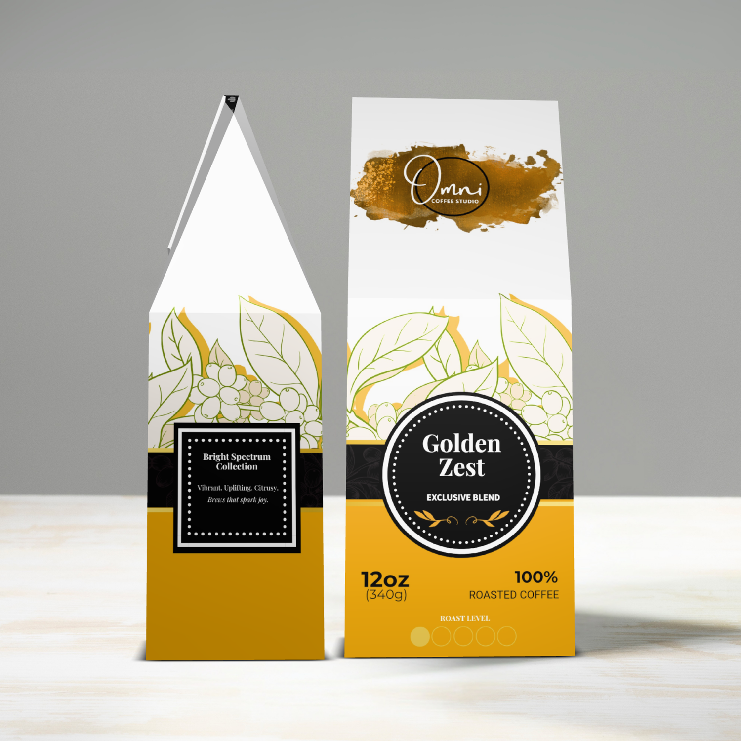 Two coffee packages labeled 'Golden Zest' on a gray background