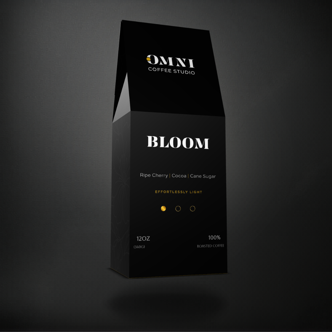 Bloom light roast specialty coffee packaging showing roast level by Omni Coffee Studio, left view on dark background.