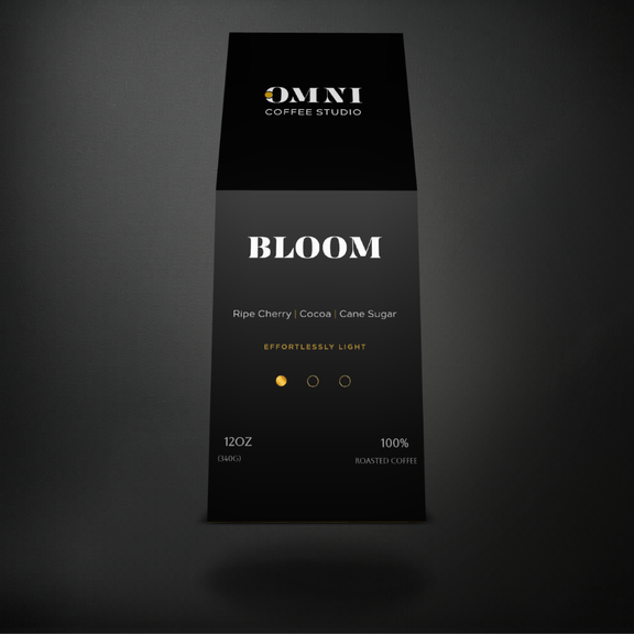 Bloom light roast specialty coffee packaging showing roast level by Omni Coffee Studio, front view on dark background.