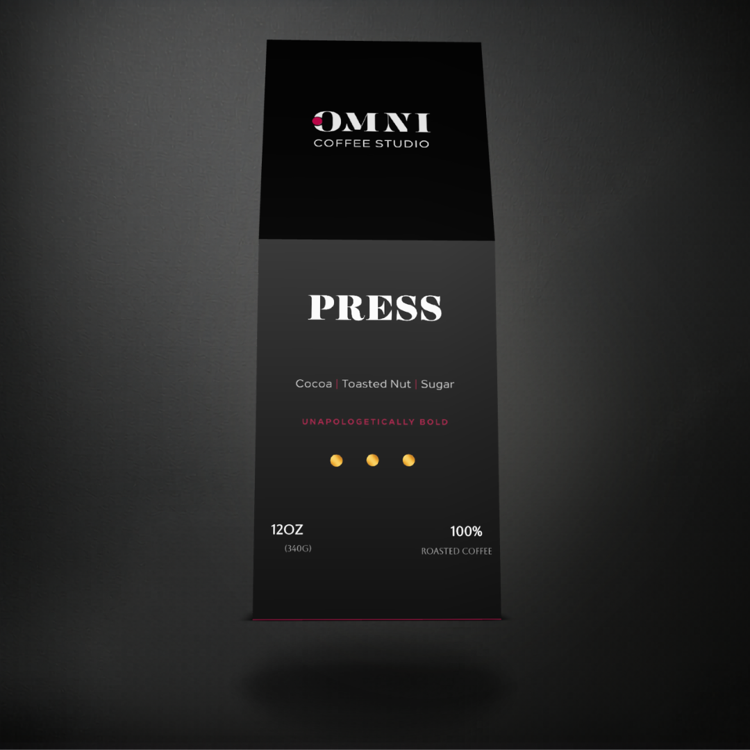 Press dark roast specialty coffee packaging showing roast level by Omni Coffee Studio, front view on dark background.