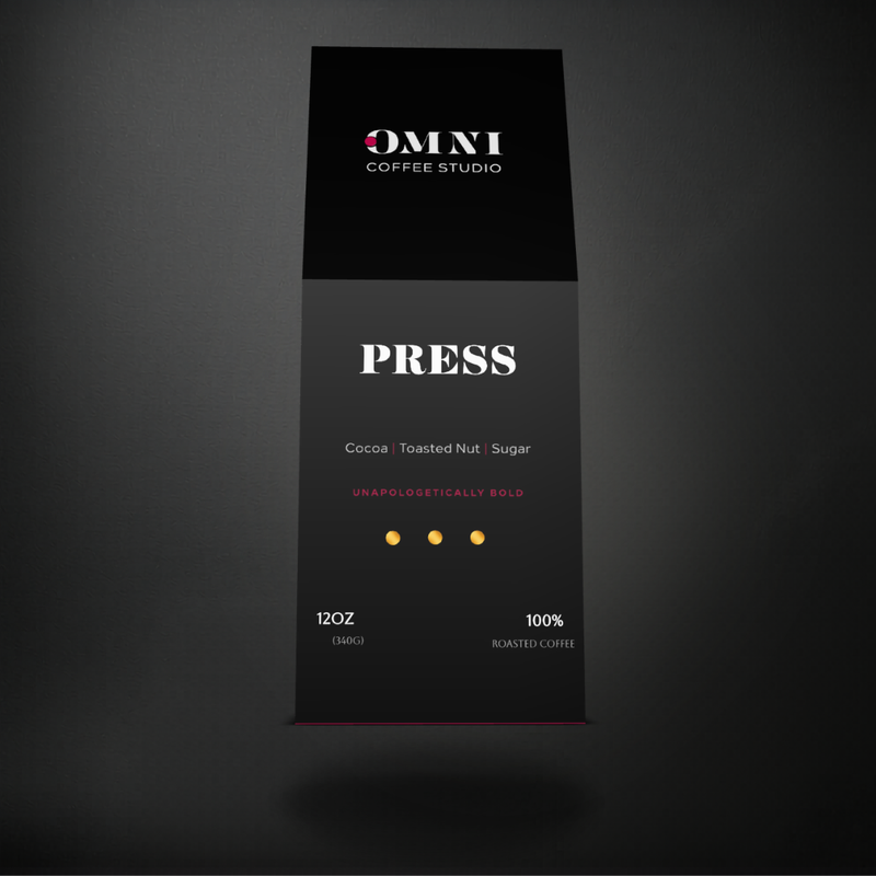 Press dark roast specialty coffee packaging showing roast level by Omni Coffee Studio, front view on dark background.