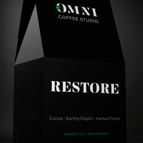 Restore coffee packaging by Omni Coffee Studio, showing a detailed view of packaging on a dark background.