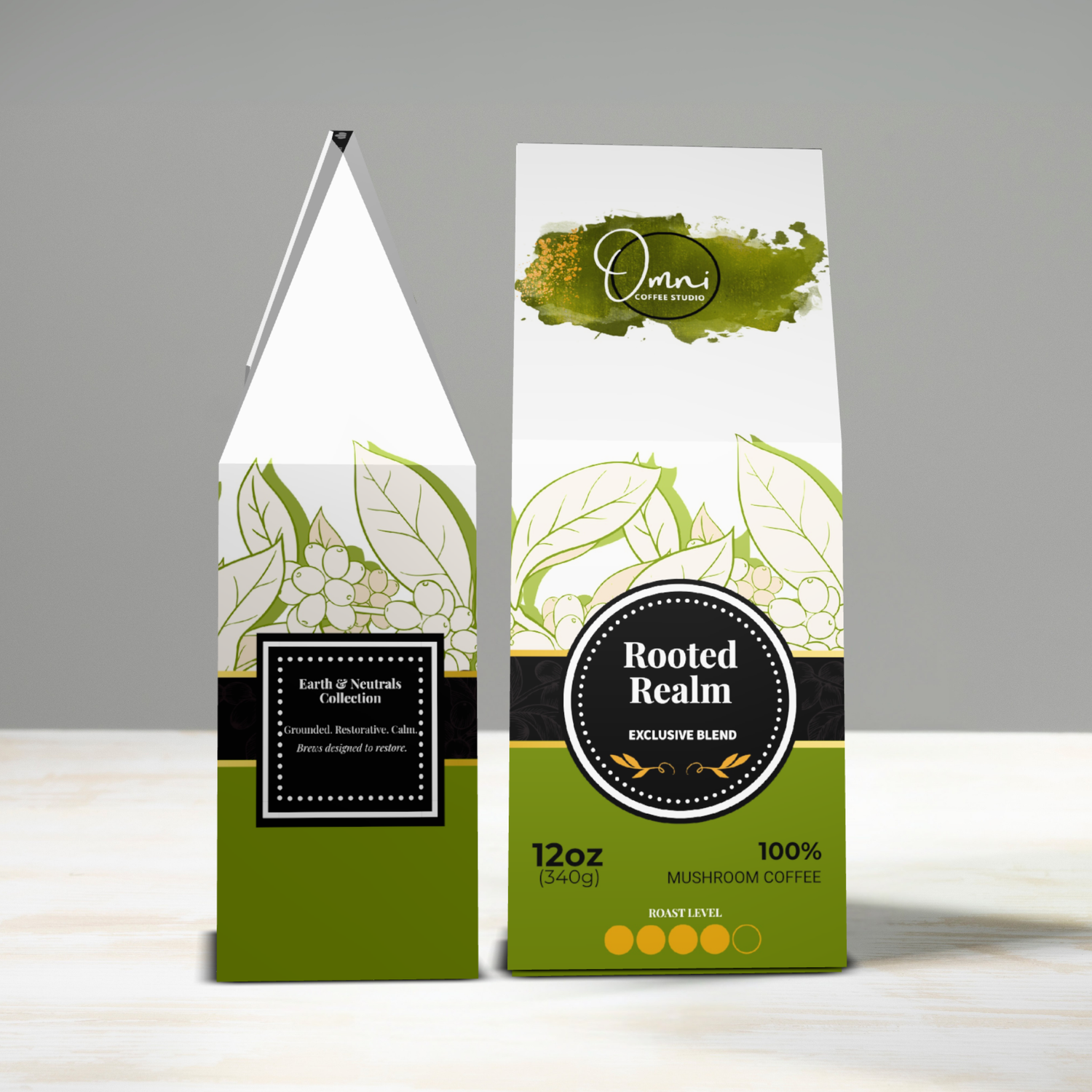 Two packages of 'Rooted Realm' mushroom coffee on a gray background