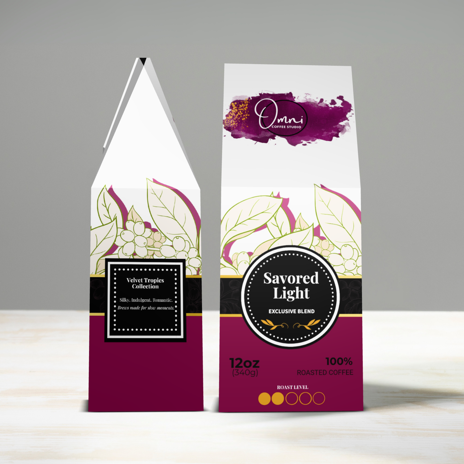 Two coffee packages with decorative labels on a gray background