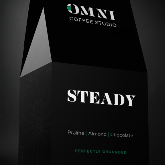 Steady coffee packaging by Omni Coffee Studio, showing a detailed view of packaging on a dark background.