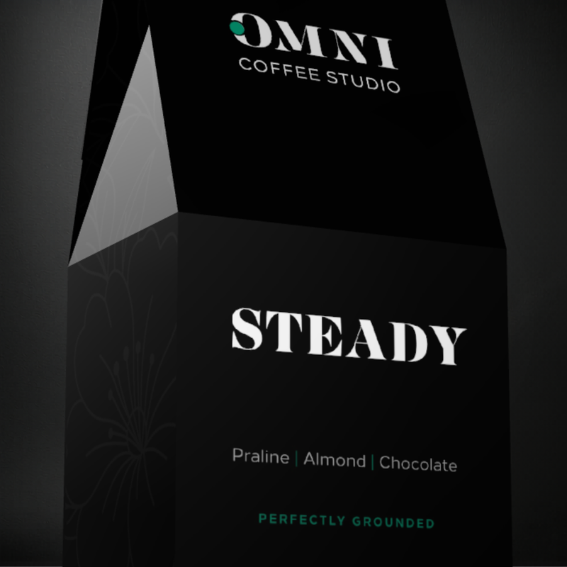Steady coffee packaging by Omni Coffee Studio, showing a detailed view of packaging on a dark background.