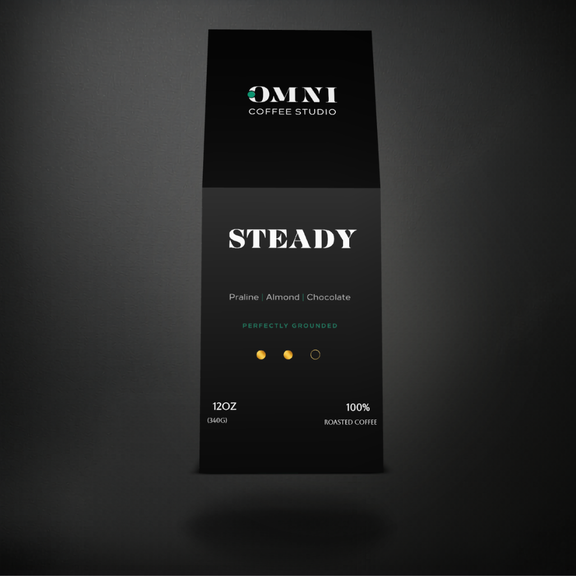 Steady medium roast specialty coffee packaging showing roast level by Omni Coffee Studio, front view on dark background.